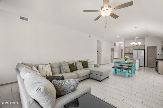 13804 Sky Ranger Ave, Horizon City, TX 79928 - living area with lofted ceiling, ceiling fan, a chandelier, and light tile patterned flooring