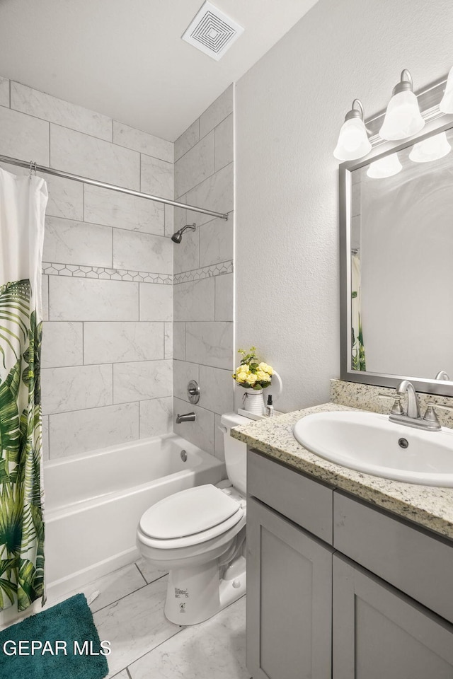 13804 Sky Ranger Ave, Horizon City, TX 79928 - full bathroom with vanity, shower / bath combo, toilet, and marble look tiles