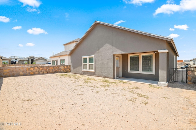 13804 Sky Ranger Ave, Horizon City, TX 79928 - back of property featuring stucco siding, a fenced backyard, and a patio