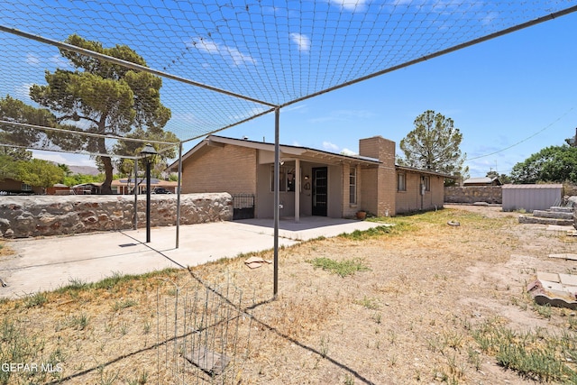 4112 Blackstone Ct, El Paso, TX 79922 - back of property featuring a patio area and a chimney