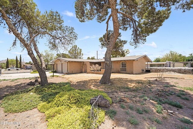 4112 Blackstone Ct, El Paso, TX 79922 - view of front of property with brick siding, driveway, and an attached garage