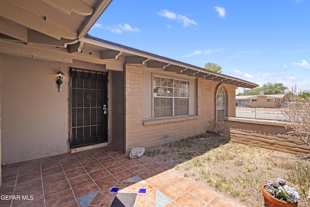4112 Blackstone Ct, El Paso, TX 79922 - view of exterior entry with a patio and brick siding
