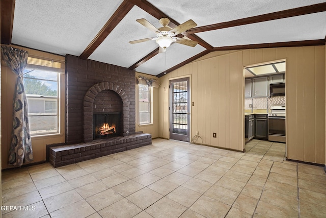4112 Blackstone Ct, El Paso, TX 79922 - unfurnished living room with a textured ceiling, healthy amount of natural light, light tile patterned floors, a brick fireplace, and a ceiling fan