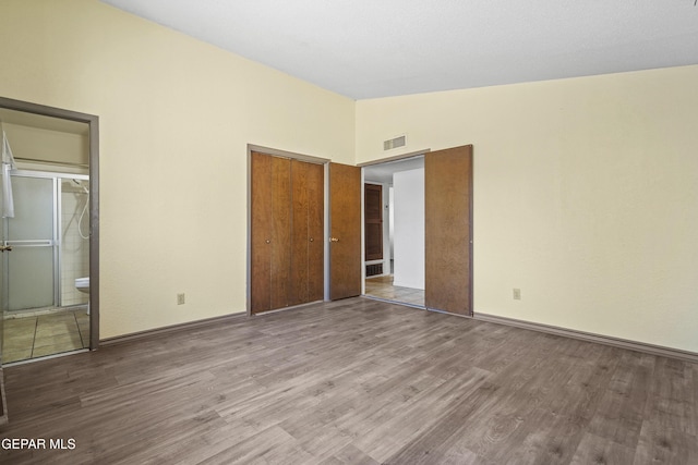 4112 Blackstone Ct, El Paso, TX 79922 - unfurnished bedroom with wood finished floors, a closet, and baseboards