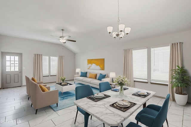 1129 Indigo Sky St, El Paso, TX 79928 - dining area featuring light marble finish floors, a chandelier, lofted ceiling, and ceiling fan