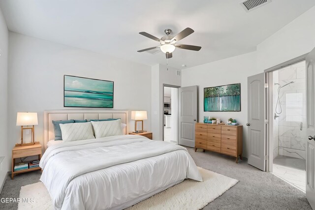 1129 Indigo Sky St, El Paso, TX 79928 - bedroom with light carpet, ensuite bathroom, and ceiling fan