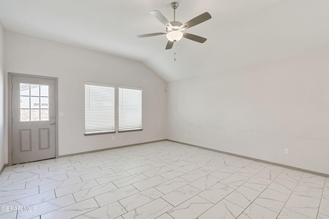 1129 Indigo Sky St, El Paso, TX 79928 - spare room featuring light marble finish floors, lofted ceiling, plenty of natural light, a ceiling fan, and baseboards