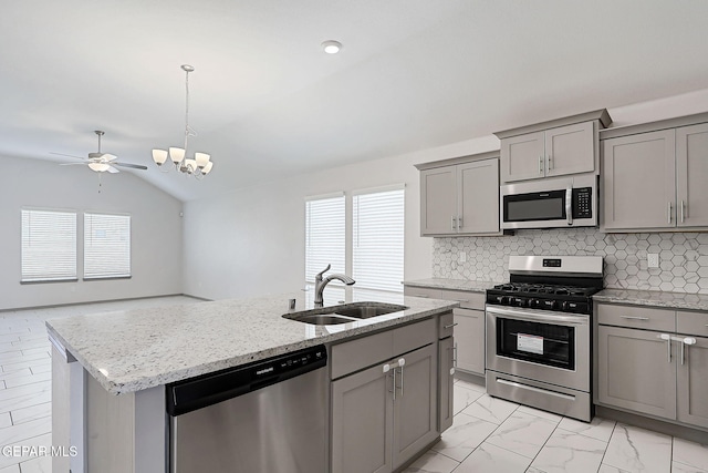 1129 Indigo Sky St, El Paso, TX 79928 - kitchen featuring stainless steel appliances, gray cabinets, a sink, healthy amount of natural light, and lofted ceiling