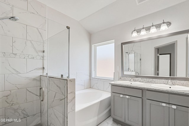 1129 Indigo Sky St, El Paso, TX 79928 - bathroom with a garden tub, a marble finish shower, double vanity, lofted ceiling, and marble look tile flooring