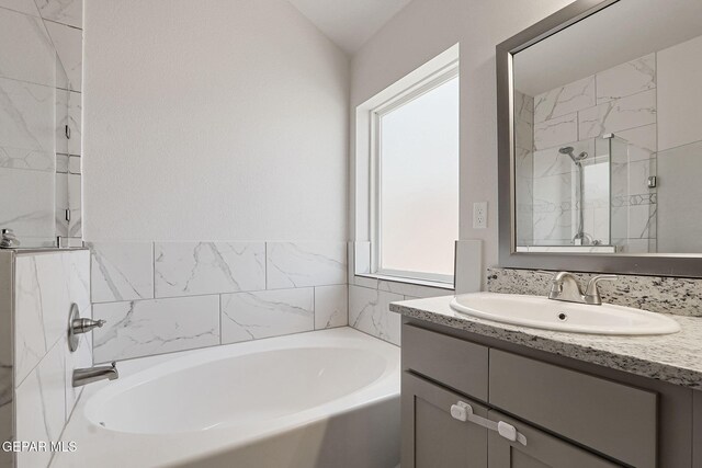 1129 Indigo Sky St, El Paso, TX 79928 - full bathroom featuring a garden tub, vanity, and a shower