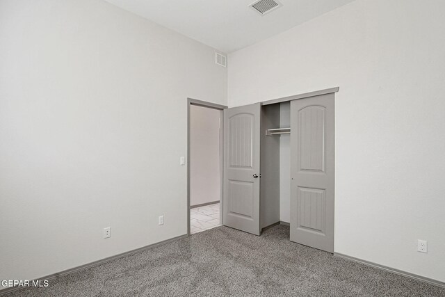 1129 Indigo Sky St, El Paso, TX 79928 - unfurnished bedroom featuring a closet, light colored carpet, and baseboards