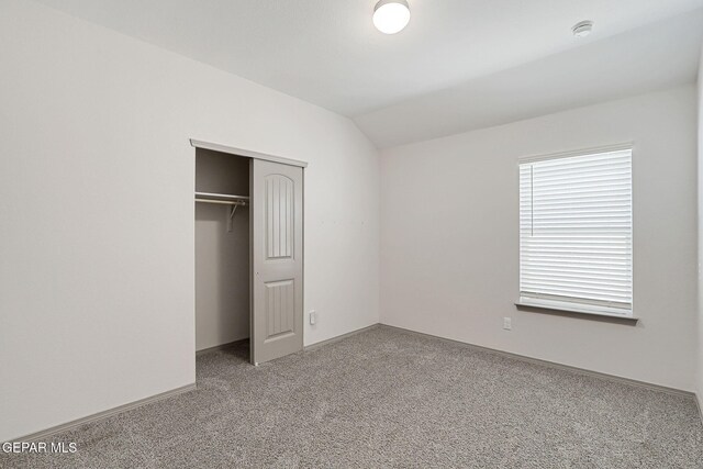 1129 Indigo Sky St, El Paso, TX 79928 - unfurnished bedroom with carpet floors, lofted ceiling, a closet, and baseboards