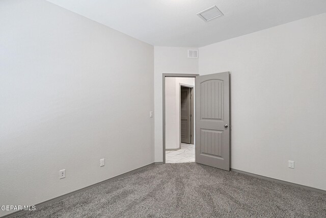 1129 Indigo Sky St, El Paso, TX 79928 - empty room featuring light carpet and baseboards