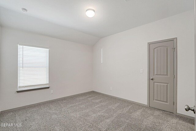 1129 Indigo Sky St, El Paso, TX 79928 - empty room with carpet, lofted ceiling, a smoke detector, and baseboards