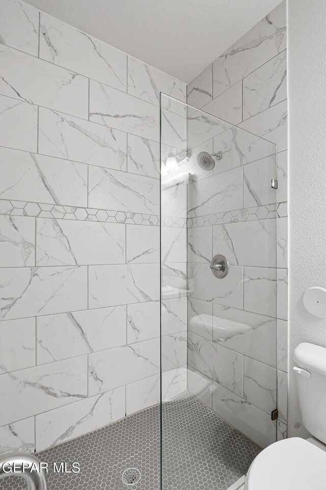 1129 Indigo Sky St, El Paso, TX 79928 - bathroom with walk in shower and toilet