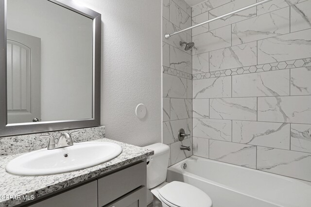 1129 Indigo Sky St, El Paso, TX 79928 - full bathroom featuring vanity, toilet, tub / shower combination, and a textured wall
