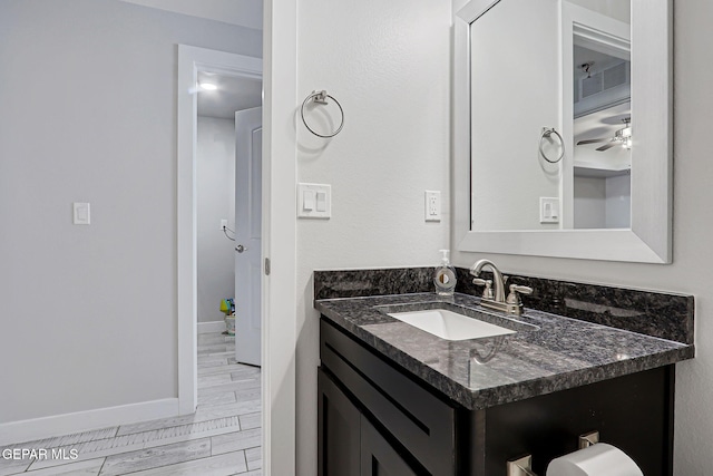 14733 Charles Foster Ave, El Paso, TX 79938 - bathroom featuring vanity, baseboards, and ceiling fan