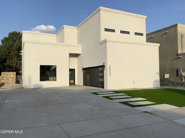 2052 Crystal Ridge St, El Paso, TX 79938 - view of front of house with an attached garage, stucco siding, and driveway