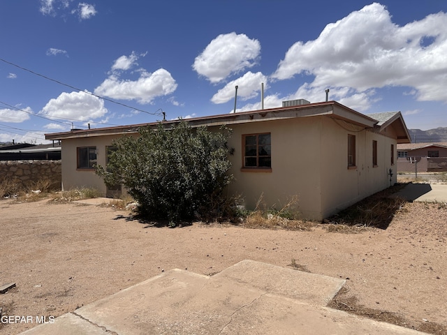 10324 Preston Dr, El Paso, TX 79924 - view of side of home with stucco siding