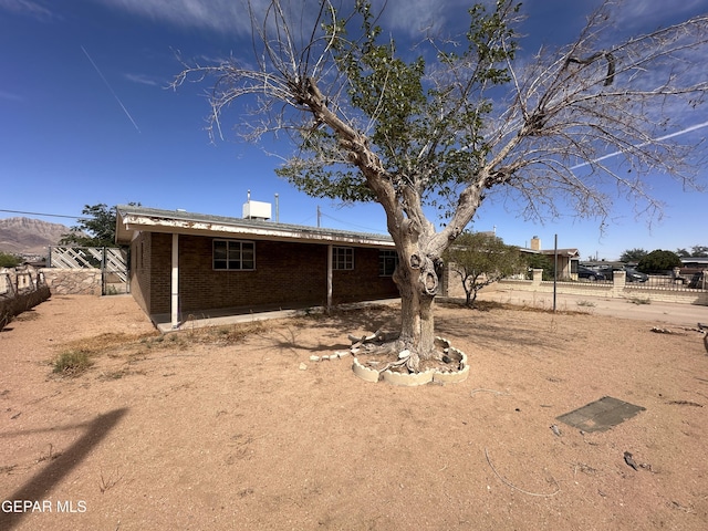 9201 Waverly Dr, El Paso, TX 79924 - rear view of property featuring brick siding