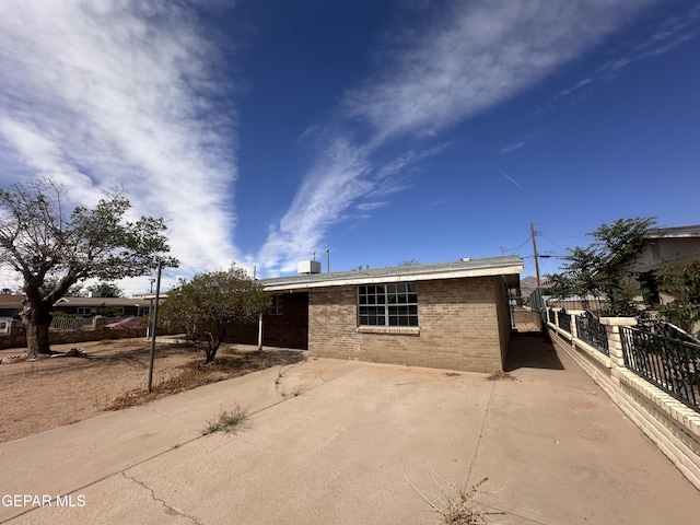 9201 Waverly Dr, El Paso, TX 79924 - single story home featuring brick siding and a patio area