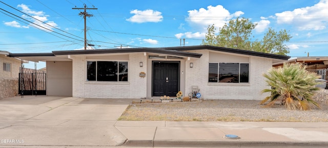 10109 Saigon Dr, El Paso, TX 79925 - view of front of home featuring brick siding and concrete driveway