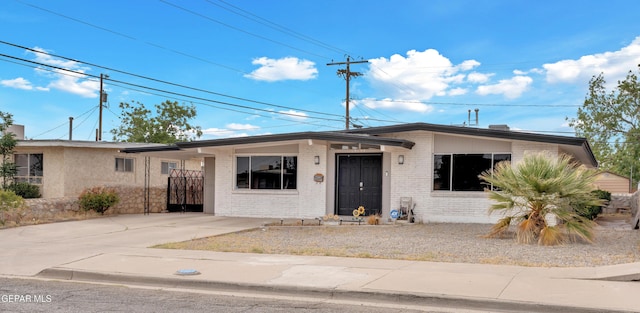 10109 Saigon Dr, El Paso, TX 79925 - view of front of property with brick siding and driveway