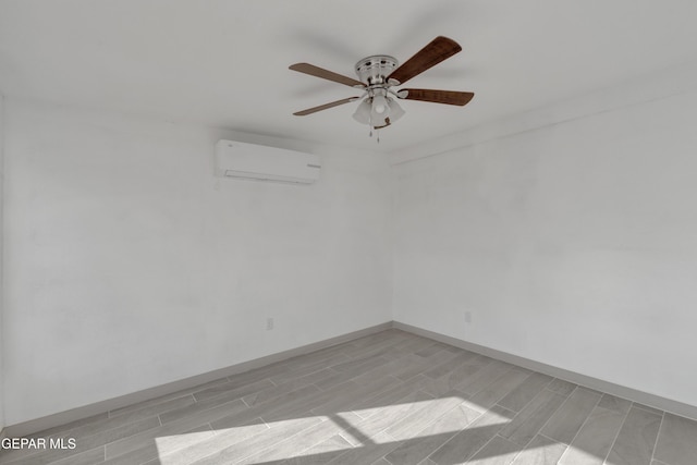 10109 Saigon Dr, El Paso, TX 79925 - empty room with a wall mounted air conditioner, ceiling fan, and wood finish floors