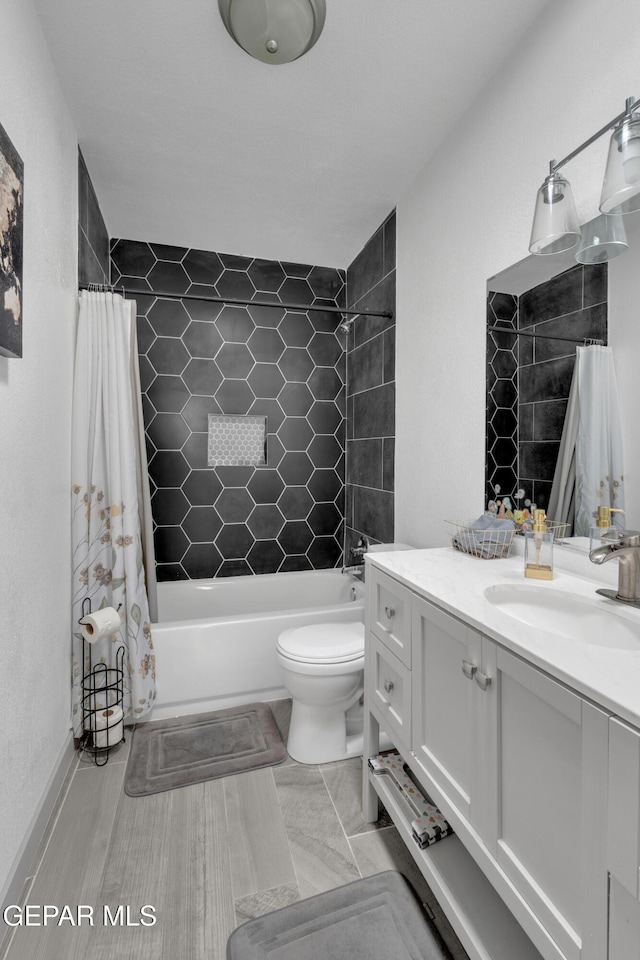 10109 Saigon Dr, El Paso, TX 79925 - full bath with vanity, shower / tub combo with curtain, and toilet