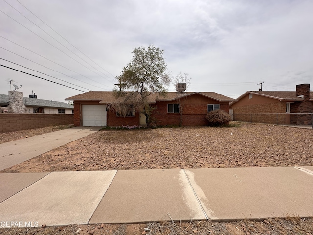 10328 Thor St, El Paso, TX 79924 - ranch-style home featuring a garage, concrete driveway, and brick siding