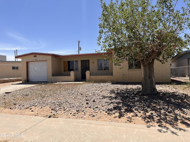 5604 Sarah Anne Ave, El Paso, TX 79924 - single story home featuring brick siding, an attached garage, and concrete driveway