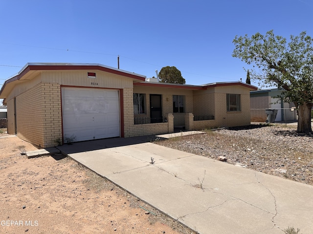 5604 Sarah Anne Ave, El Paso, TX 79924 - single story home with brick siding, a garage, and concrete driveway
