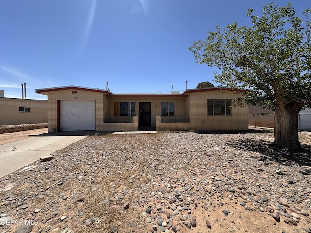 5604 Sarah Anne Ave, El Paso, TX 79924 - ranch-style house featuring brick siding, a garage, and driveway
