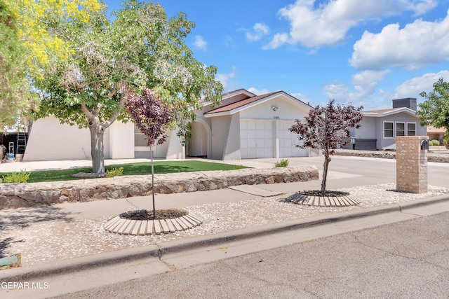 11185 Tenaha Ave, El Paso, TX 79936 - view of front of house with a garage and concrete driveway