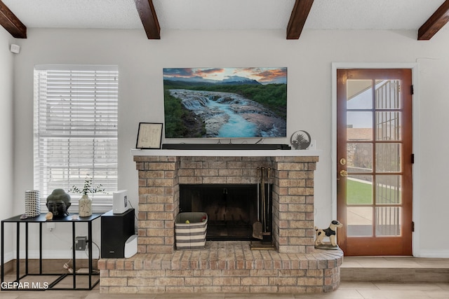 11185 Tenaha Ave, El Paso, TX 79936 - detailed view of beamed ceiling, a brick fireplace, and baseboards