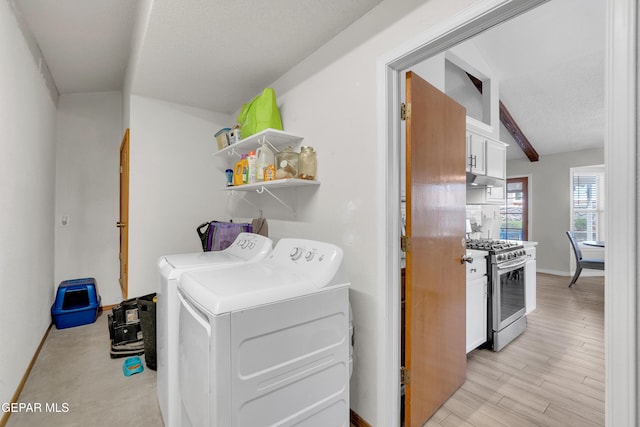 11185 Tenaha Ave, El Paso, TX 79936 - laundry area with washing machine and clothes dryer, baseboards, and a textured ceiling