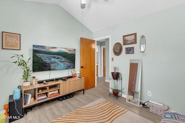 11185 Tenaha Ave, El Paso, TX 79936 - living area with wood finished floors, lofted ceiling, ceiling fan, and baseboards