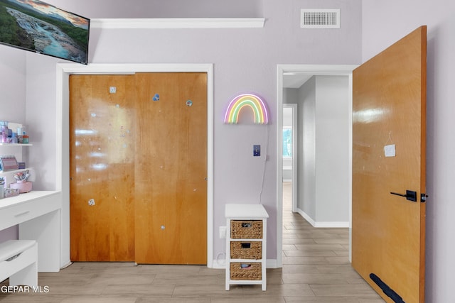11185 Tenaha Ave, El Paso, TX 79936 - hall featuring light wood-type flooring and baseboards