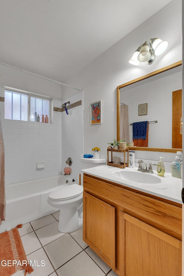 11185 Tenaha Ave, El Paso, TX 79936 - bathroom featuring vanity, tile patterned flooring, shower / tub combo, and toilet