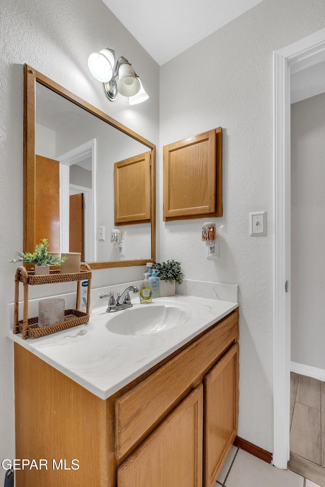 11185 Tenaha Ave, El Paso, TX 79936 - bathroom featuring vanity and baseboards