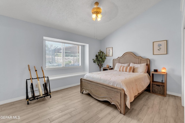 11185 Tenaha Ave, El Paso, TX 79936 - bedroom with light wood-type flooring, baseboards, a textured ceiling, vaulted ceiling, and ceiling fan