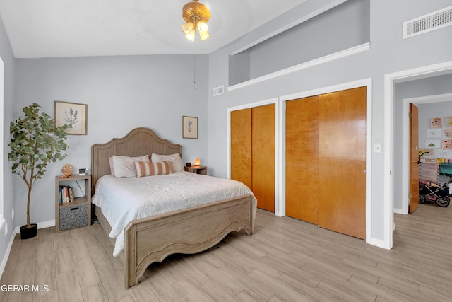 11185 Tenaha Ave, El Paso, TX 79936 - bedroom with baseboards, light wood-type flooring, multiple closets, and a high ceiling