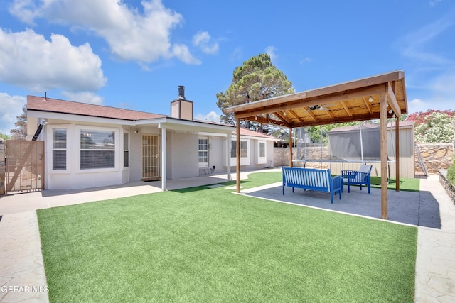 11185 Tenaha Ave, El Paso, TX 79936 - rear view of property with a patio, a chimney, and an outdoor hangout area