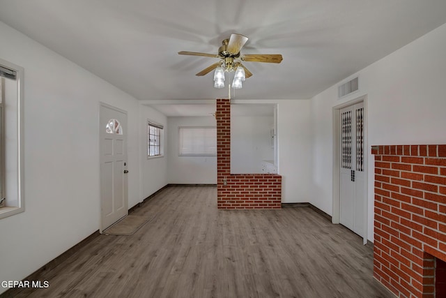 4013 Hueco Ave, El Paso, TX 79903 - unfurnished living room with wood finished floors and ceiling fan