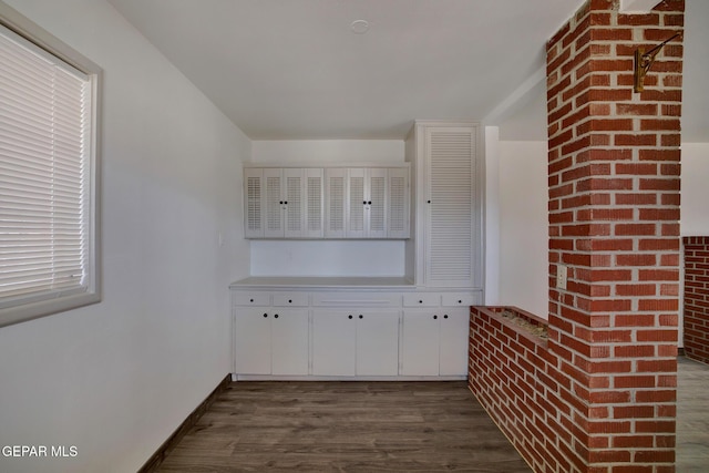 4013 Hueco Ave, El Paso, TX 79903 - bar featuring dark wood-type flooring and baseboards