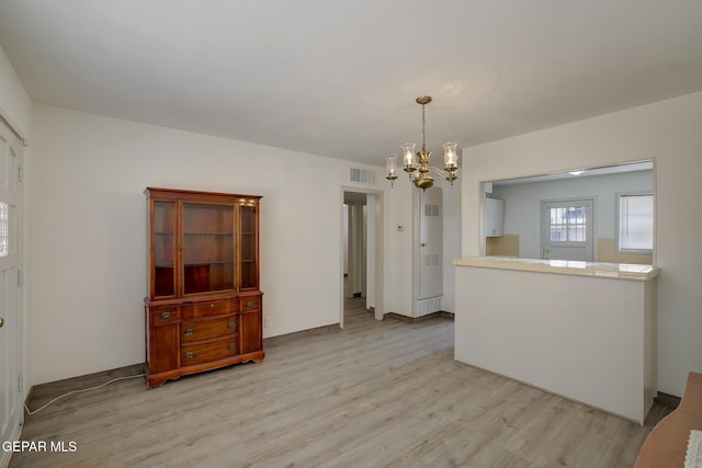 4013 Hueco Ave, El Paso, TX 79903 - dining space with a chandelier and light wood-type flooring