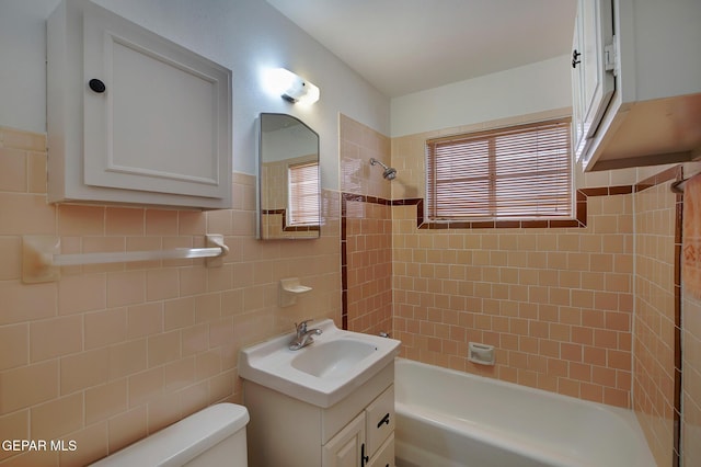 4013 Hueco Ave, El Paso, TX 79903 - full bath featuring vanity, washtub / shower combination, toilet, and tile walls