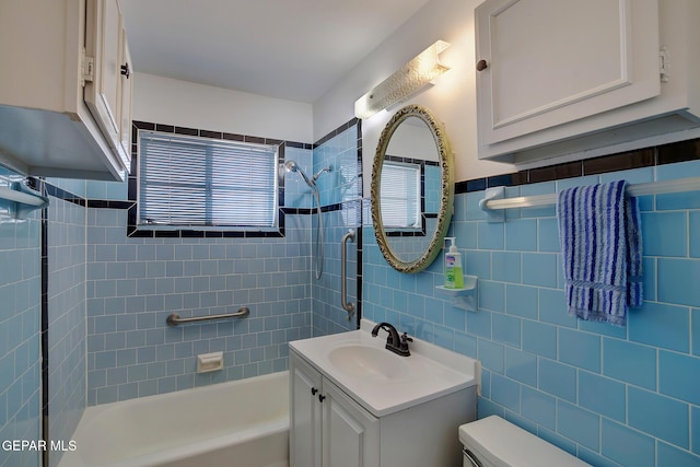 4013 Hueco Ave, El Paso, TX 79903 - bathroom with shower / bathtub combination, vanity, toilet, and tile walls