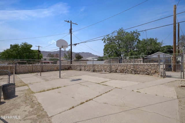 4013 Hueco Ave, El Paso, TX 79903 - view of patio with community basketball court and a gate