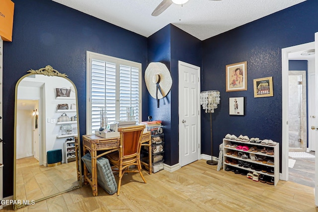 904 Las Palmas Way, El Paso, TX 79912 - office space with ceiling fan, wood finished floors, arched walkways, a textured ceiling, and baseboards